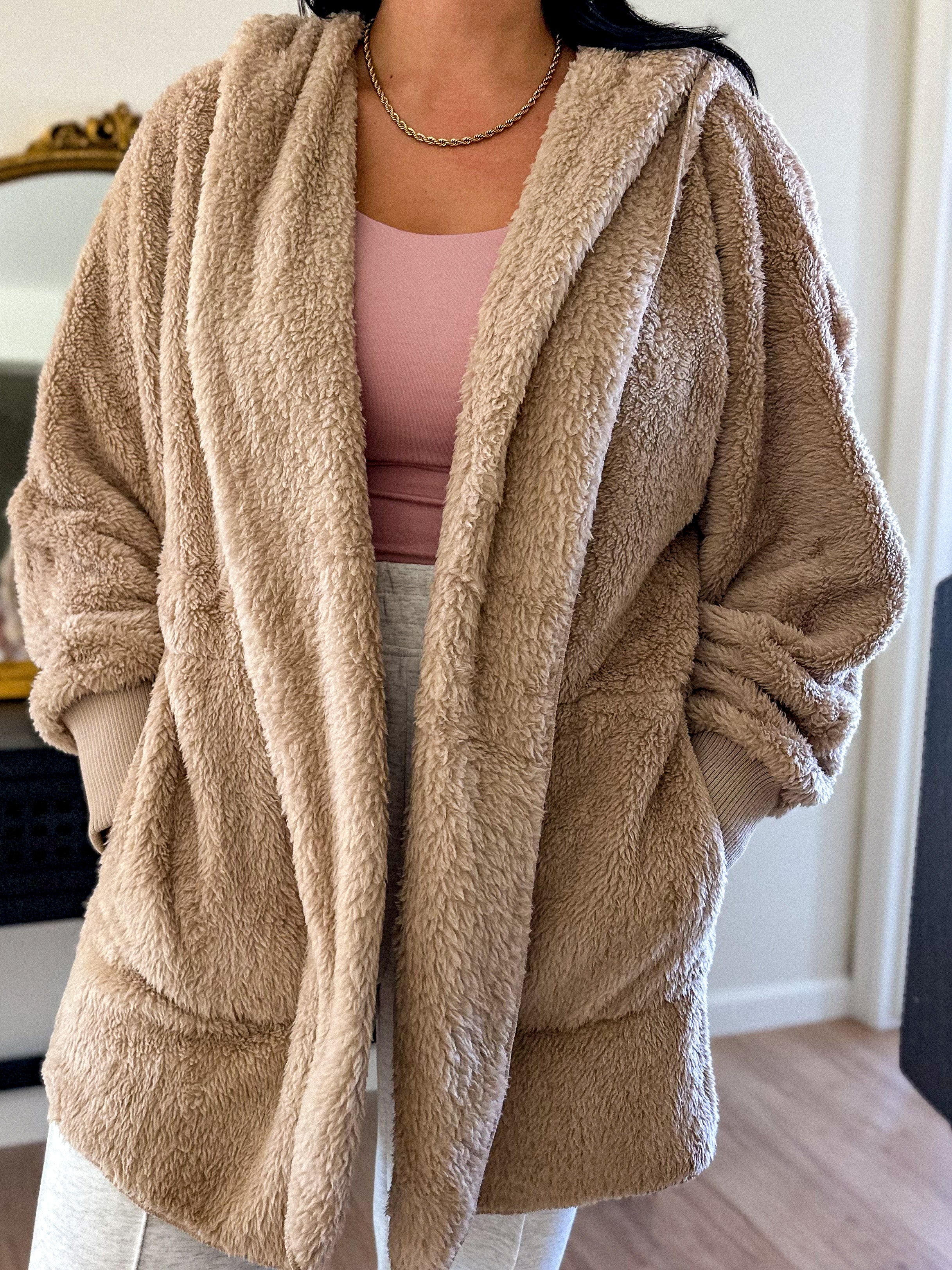 women's beige teddy bear soft, cozy, and fuzzy longer robe jacket with a hood