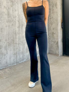 Women's black buttery soft stretchy athletic jumpsuit with adjustable straps