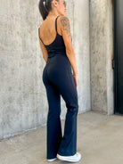 Women's black buttery soft stretchy athletic jumpsuit with adjustable straps