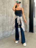 Women's black buttery soft stretchy athletic jumpsuit with adjustable straps