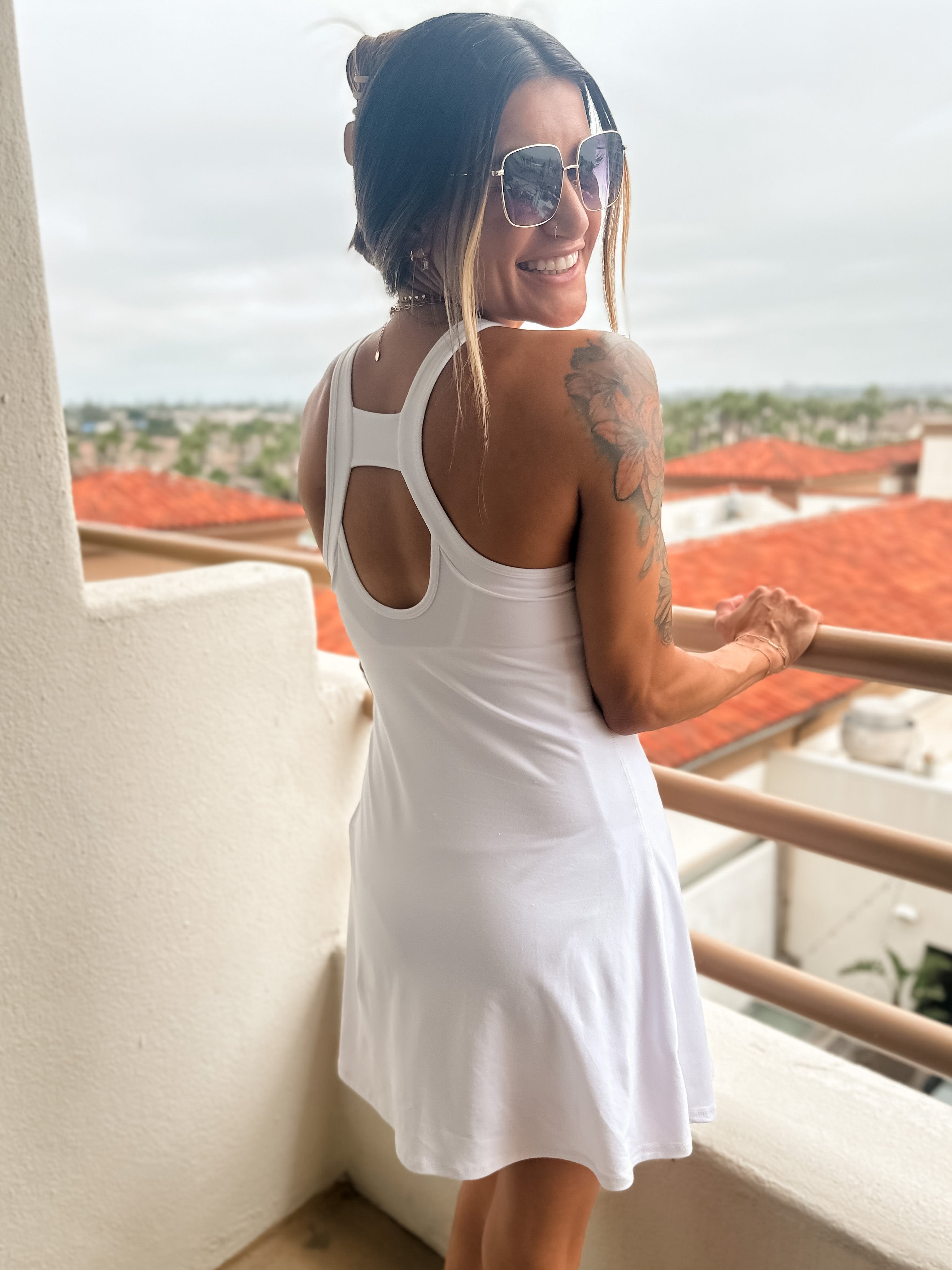 comfortable buttery soft white active romper dress with built in shorts