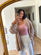 women's beige teddy bear soft, cozy, and fuzzy longer robe jacket with a hood