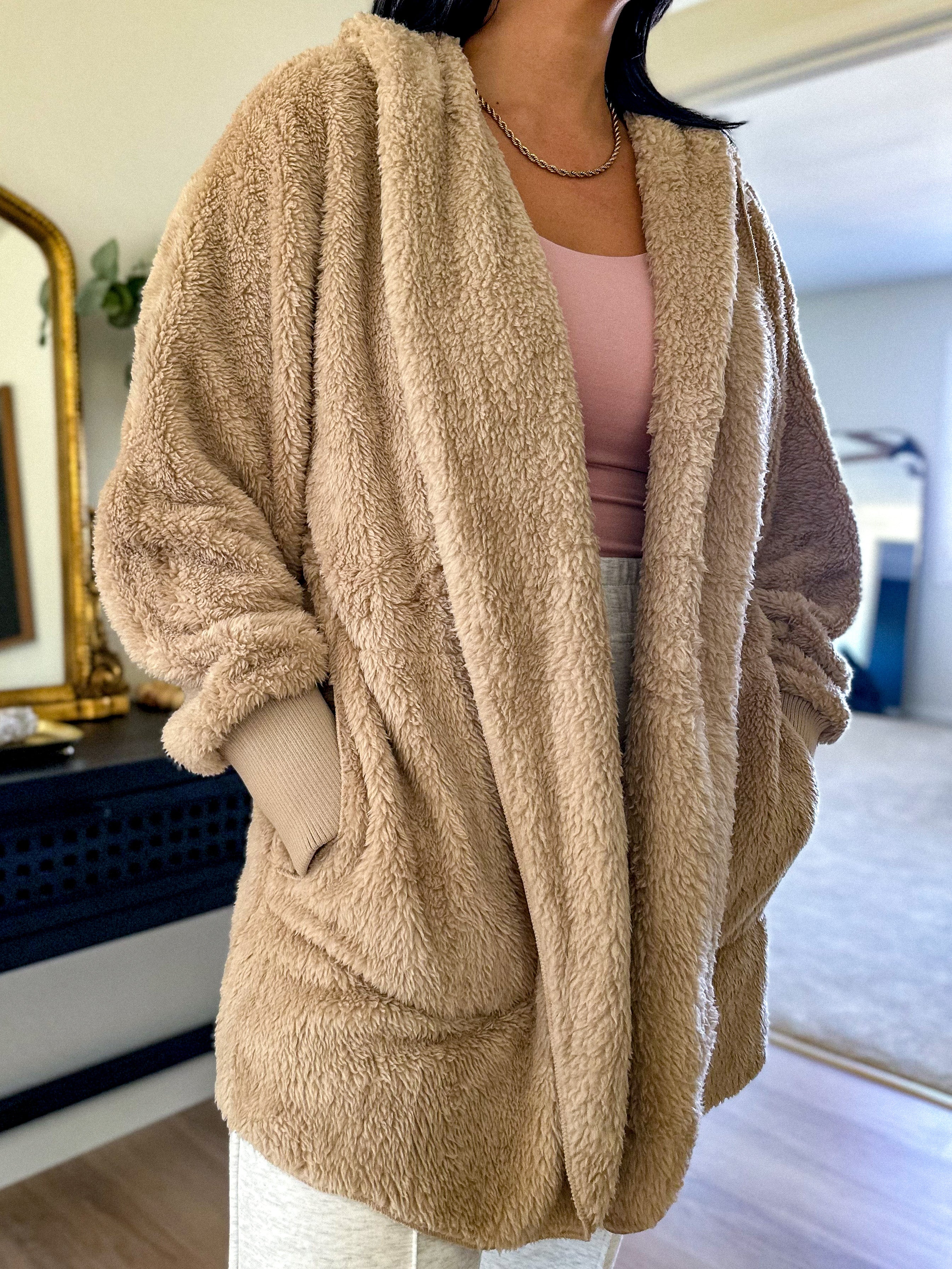 women's beige teddy bear soft, cozy, and fuzzy longer robe jacket with a hood