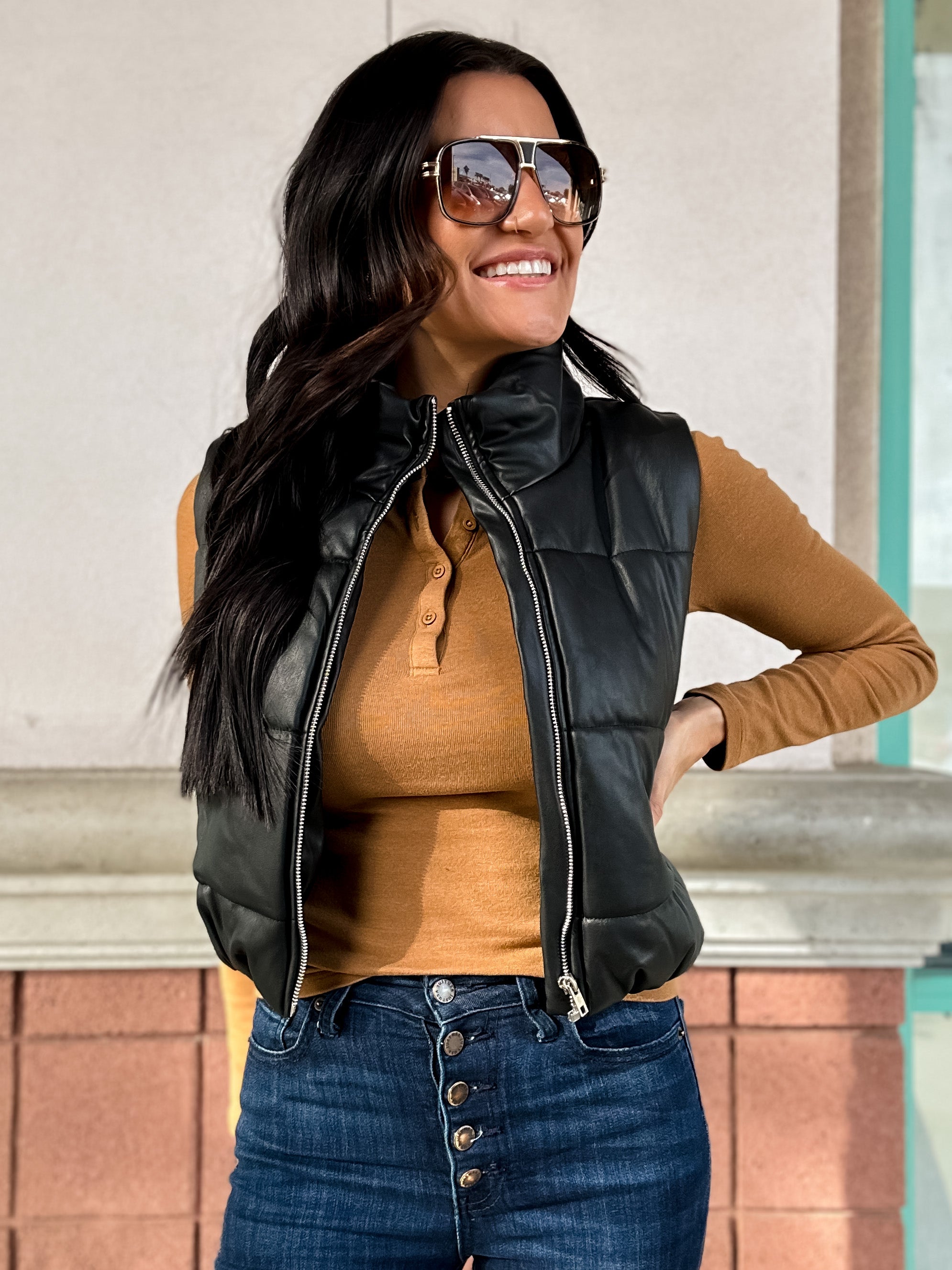 black vegan leather puffer vest with zipper