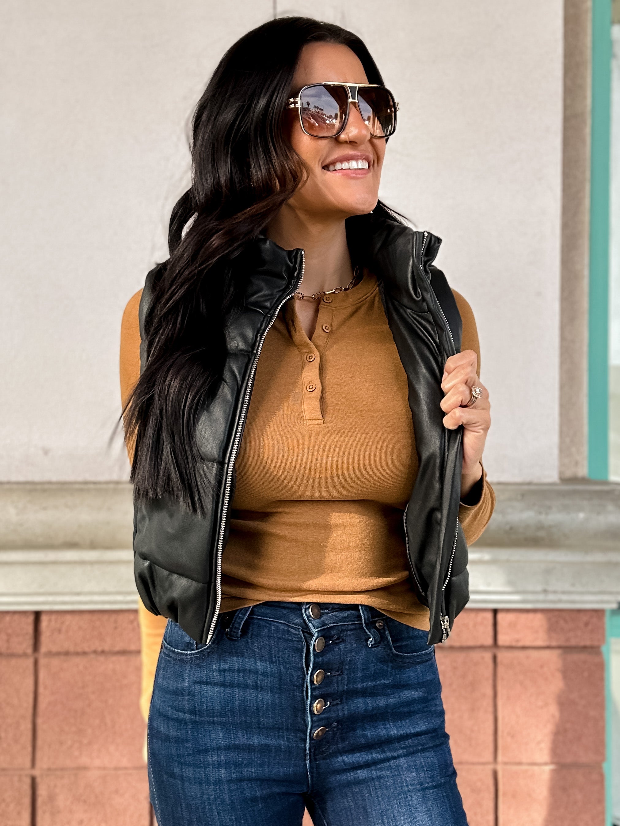black vegan leather puffer vest with zipper