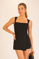 Black romper mini dress with shorts and a square neckline